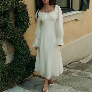 Midi dress with pleated bodice and wide cuffs